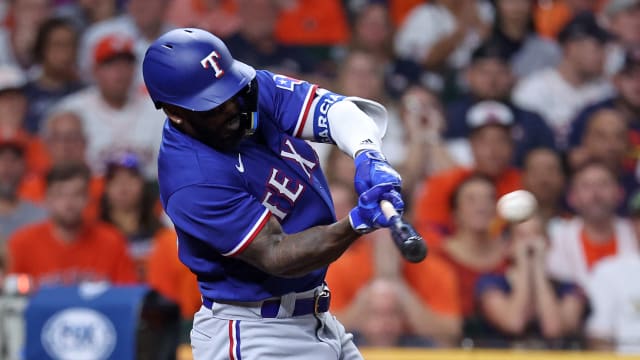 Oct 22, 2023; Houston, Texas, USA; Texas Rangers right fielder Adolis Garcia (53) hits a grand slam against the Houston Astros in the ninth inning during game six of the ALCS for the 2023 MLB playoffs at Minute Maid Park. Mandatory Credit: Troy Taormina-USA TODAY Sports  